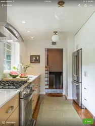 Photo of a narrow kitchen in a house with a window