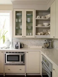 Photo of a kitchen with a microwave in a niche