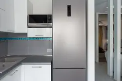 Silver refrigerator in the kitchen interior