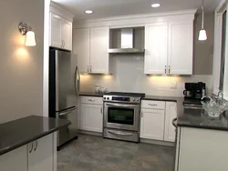 Silver refrigerator in the kitchen interior