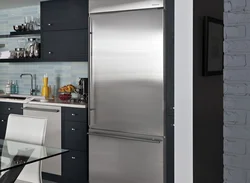 Silver refrigerator in the kitchen interior