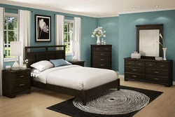 Dark furniture in a light bedroom interior