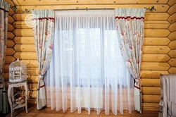 Curtains in the kitchen in a wooden house photo