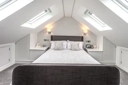 Attic design with a gable roof bedroom photo