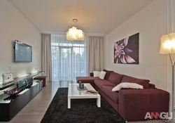 Narrow living room design with corner sofa
