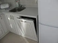 Small kitchen with dishwasher and refrigerator photo