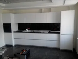 White Kitchen With Black Handles And Black Countertop Photo