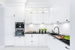 White kitchen with black handles and black countertop photo