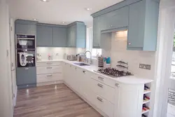 Gray blue kitchen with white photo