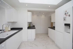 White porcelain tiles in the kitchen interior photo