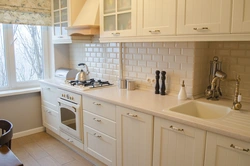 Kitchens with beige tile splashback photo
