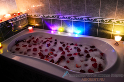 Bath with roses and foam photo