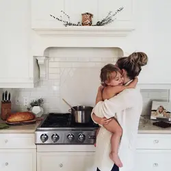 Photo of mom at home in the kitchen