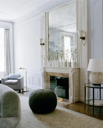 Mirror above the fireplace in the living room interior photo