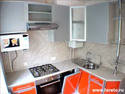 Kitchen in Khrushchev design with refrigerator and dishwasher