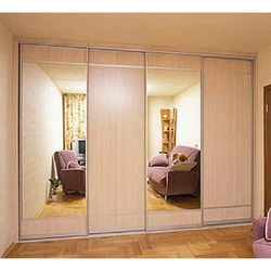 Wardrobe in the bedroom with a mirror for 4 doors photo