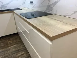 Oak ceramic countertop in the kitchen interior photo