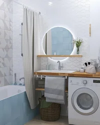 Washing machine under the sink in the bathroom design