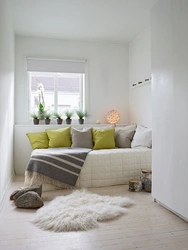 Sofa in a small bedroom instead of a bed interior photo