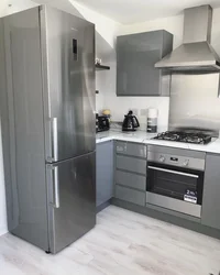 White Kitchen With Gray Refrigerator Photo
