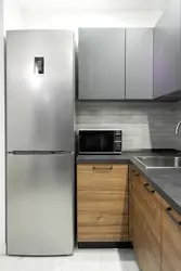 White Kitchen With Gray Refrigerator Photo