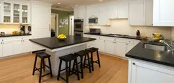 White kitchen black table in the interior