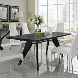 White kitchen black table in the interior