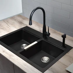 Photo Of A Kitchen With A White Countertop And A Black Sink