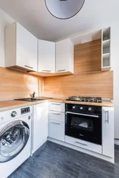Small kitchen design with refrigerator, washing machine