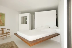 Floating bed in the bedroom interior