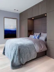 Bedroom design with wardrobes on the sides