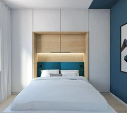 Bedroom design with wardrobes on the sides