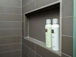 Shelves in the bathroom made of tiles in the wall photo
