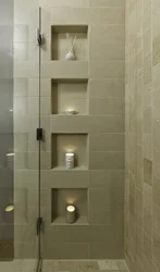 Shelves in the bathroom made of tiles in the wall photo