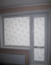 Roller blinds for a balcony door with a window in the kitchen photo