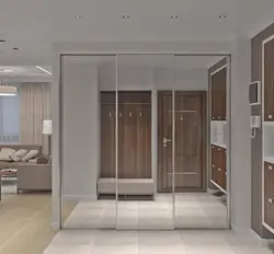 Modern sliding wardrobe in the hallway with a mirror photo design