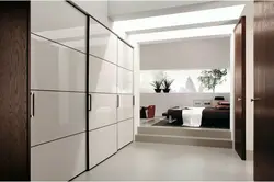 Modern sliding wardrobe in the hallway with a mirror photo design