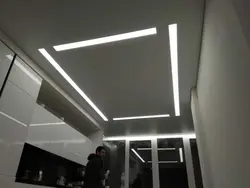 Light lines on a suspended ceiling in the bathroom photo