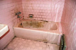 Old bathtub in the apartment photo