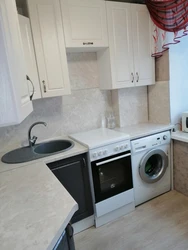 Kitchen design in Khrushchev with a refrigerator and washing machine