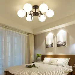 Suspended ceilings lighting photo in the bedroom with a chandelier