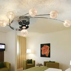 Chandelier in the living room on a suspended ceiling in a modern style photo