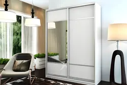 Wardrobe in the bedroom with a mirror for two doors photo