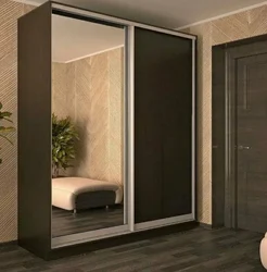 Wardrobe in the bedroom with a mirror for two doors photo