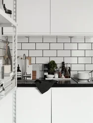 Grout on white tiles in the kitchen photo