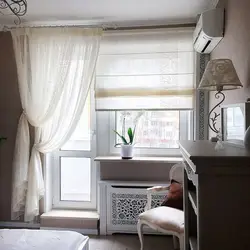 Window to the bedroom with a balcony door photo