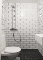 Bath white tiles black grout photo