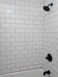 Bath white tiles black grout photo