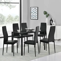 White table with black chairs in the kitchen interior