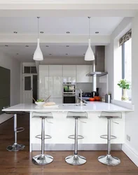 Modern kitchens with a breakfast bar and a window photo